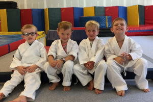 four young karate students